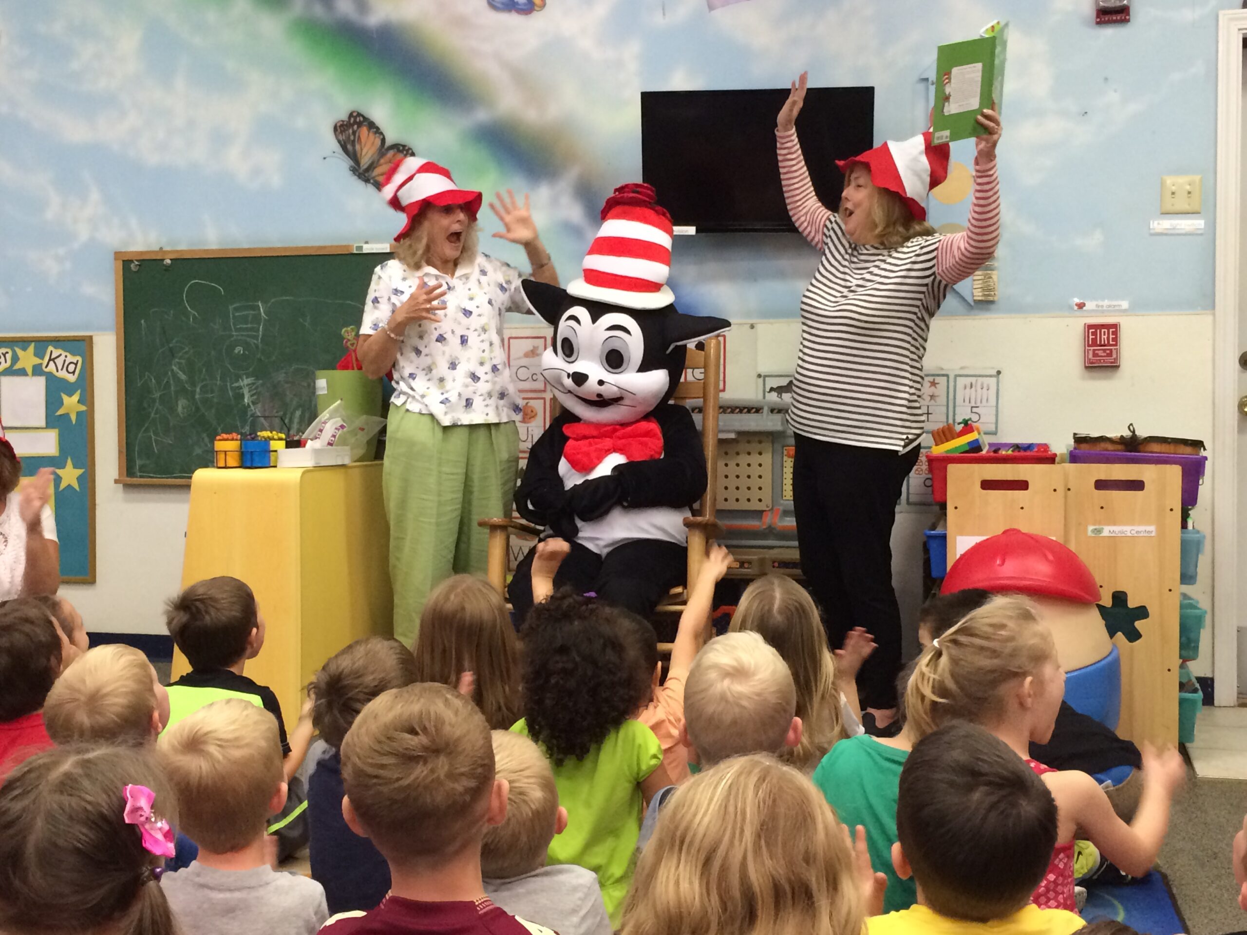 ELC volunteers Cathy Voss, Teresa Widman and special guest “The Cat in the Hat” enjoy story time at KidsFirst Learning Center in Middleburg.